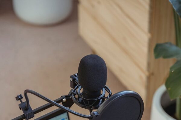 microphone on tripod attached to laptop in studio